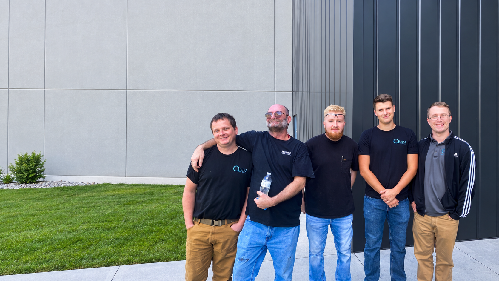 Five Quin Global USA team members outside the Omaha facility